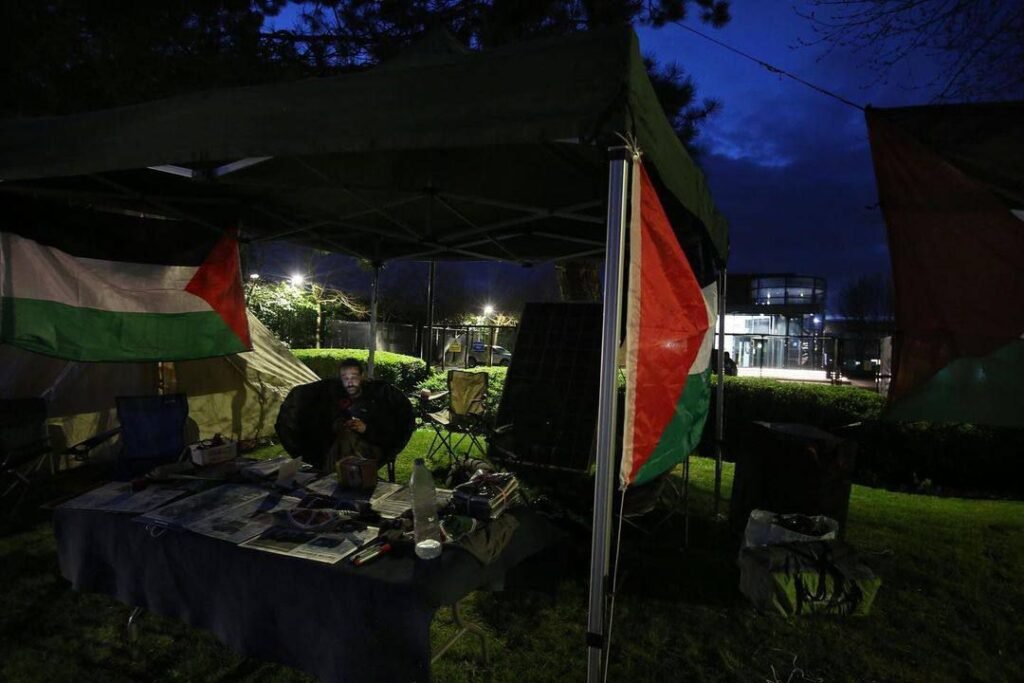 img_20240330_195258_898181489791746752986-1024x683 As night falls, the Palestine flag flys high in front of Elbit's Bristol HQ.We will be here day and night occupying the front of the Israeli weapons maker, building the resistance until Elbit is gone for good!Join us at Elbit, Aztec West 600, Patchway, Bristol This space is ours.