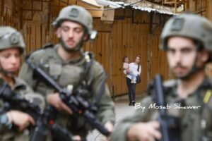 img_20240529_192513_7777133902448537418907-300x200 A Palestinian woman was assaulted during the deployment of settlers under the protection of the Israeli army in Hebron.