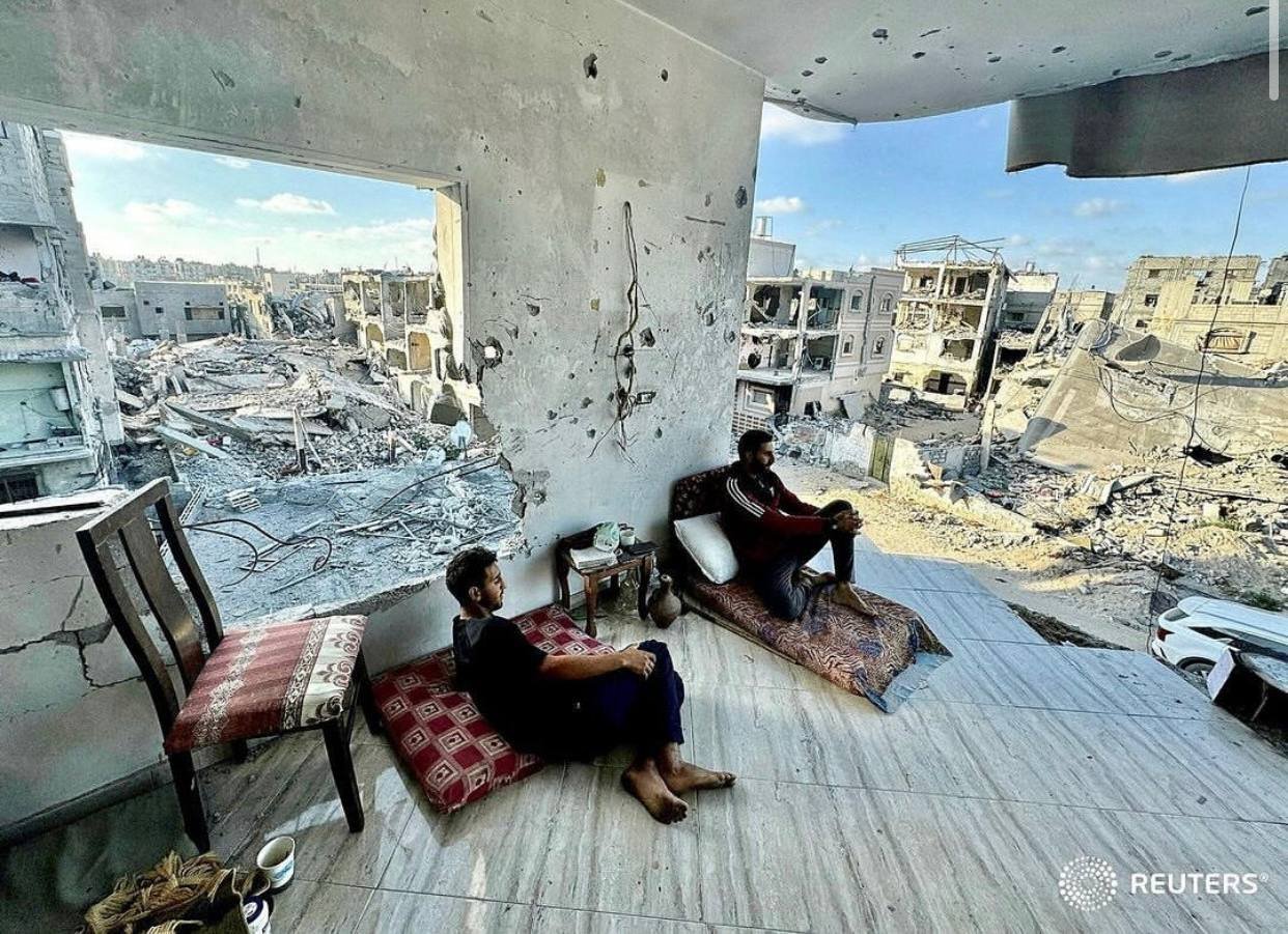 IMG_20240607_092441_906 Palestinians sit in their house which was destroyed in an Israeli strike in Khan Younis, in the southern Gaza Strip.