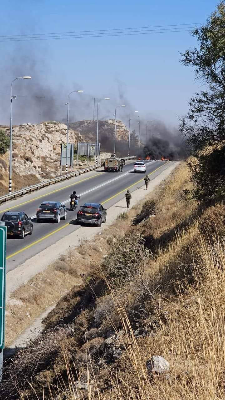 IMG_20240703_193153_600 Israeli settlers have burned tires on the main street east of Al-Bireh, blocking Palestinians' access to their villages and communities in the area.